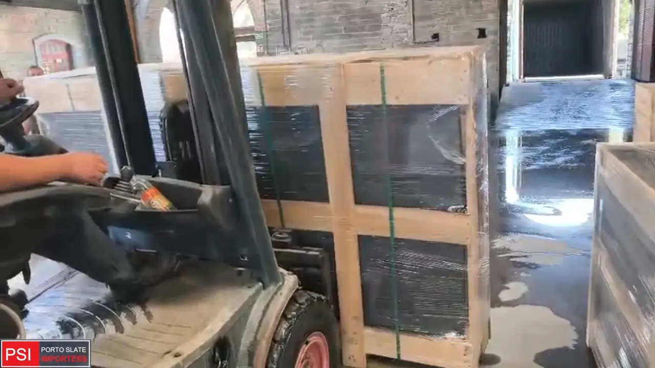 Loading VALONGO BLACK slate, custom order and inventory at quarry, into container, in preparation to ship